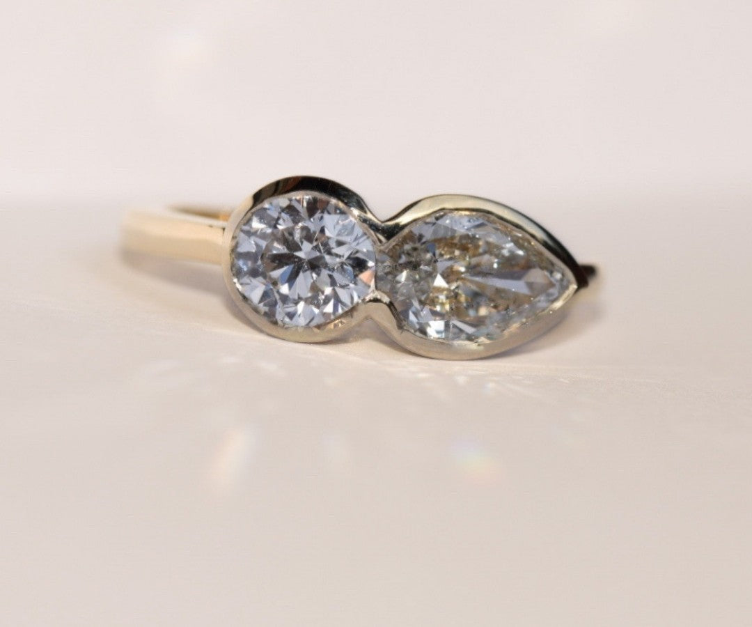 Two-stone bezel ring made from a mother's round diamond and a pear diamond, redesigned by Kate Rose