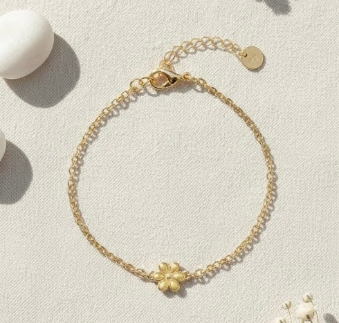 14K solid gold mini flower bracelet with delicate chain and flower charm by Kate Rose Fine Jewelry